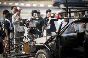John H. Lee on location in Bangkok shooting 
