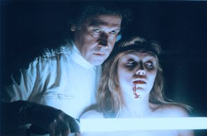 FEAR DOT COM - Stephen Rea menaces victim. (WB)