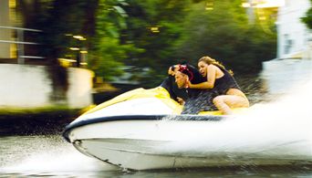 Jason Statham, Amber Valletta, and Angelina Assereto in Transporter 2 (2005)