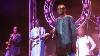 Youssou N'dour and band on stage in Senegal filmed for 