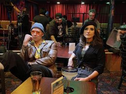 Ethan Daniel Corbett and Malili Dib wait as their scene is set up.