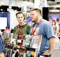 Sean Patrick O'Reilly and Mark Poulton at the Arcana booth at San Diego Comic Con.