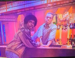 Screen shot taken from the UK Sitcom 'In the Long Run 3' Episode 3. Kenny-Lee Mbanefo playing the role of the Milton Arm