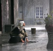 Matilde praying for the rain to stop