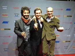 Till Nowak (middle),Ivan Robles Mendoza (left),Andreas Radzuweit (right),receiving the German Shortfilm Award for 