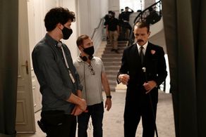 Felix Wiedemann, Anthony Fabian and Lambert Wilson on the set of Mrs. Harris Goes to Paris