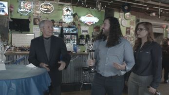 Still from “Science Boys High School Reunion” reunion scene featuring Mr. Blackwell and Scott Thresher