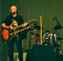 Drumming as part of David Carradine's Cosmic Rescue Team, in NY 2002