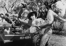 Erick Bowen, Lena Farugia, Hans Strydom, and Treasure Tshabalala in The Gods Must Be Crazy II (1989)