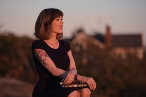 Author Tara Moss with her books The Fictional Woman and Speaking Out.