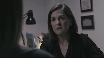 Erin Bradley Dangar as Detective Amy Moore in Murder Comes to Town, 