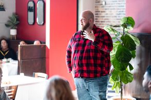 Samuel T Weston speaking at a mixer at FilmQuest 2022.