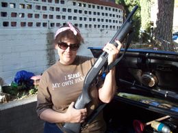 Co-producer/SFX Coordinator, Gigi Bannister, poses with a prop on location of 