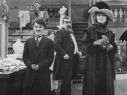 Charles Chaplin, Eric Campbell, and Charlotte Mineau in The Floorwalker (1916)