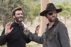 Hugh Parker as Father O'Rourke and Christopher Sommers as James Dalton in Bullets for the Dead