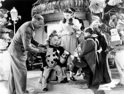 Judy Garland, Charles Becker, and Victor Fleming in The Wizard of Oz (1939)