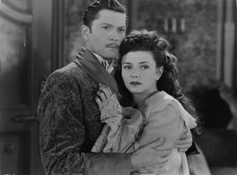 Lenore Aubert and Carl Esmond in The Catman of Paris (1946)