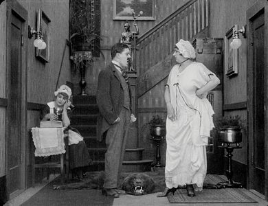 Billy Armstrong, Marta Golden, and Edna Purviance in Work (1915)