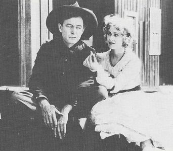 Harry Carey and Peggy Pearce in Ace of the Saddle (1919)