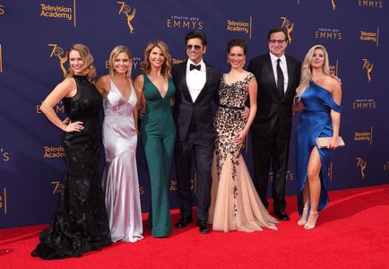 John Stamos, Andrea Barber, Candace Cameron Bure, Lori Loughlin, Bob Saget, Caitlin McHugh, and Kelly Rizzo at an event 