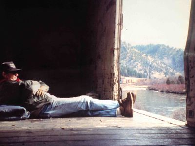 Bobb Hopkins aka Santa Fe Bo riding a freight in Montana