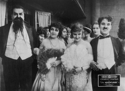 Charles Chaplin, Eric Campbell, Marta Golden, and Edna Purviance in The Adventurer (1917)