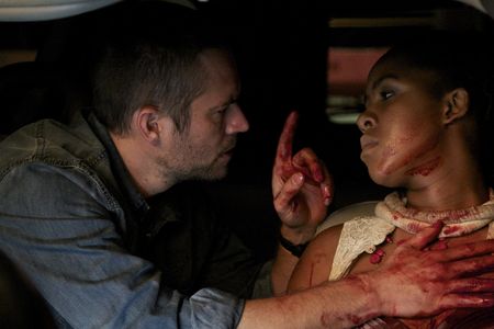 Paul Walker and Naima McLean in Vehicle 19 (2013)
