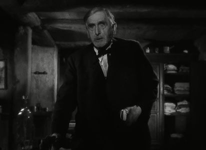 Maurice Schutz in It Happened at the Inn (1943)