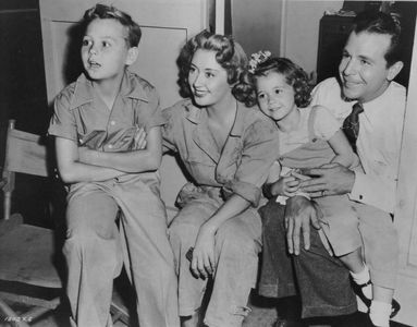 Joan Blondell, Dick Powell, Ellen Powell, and Norman S. Powell
