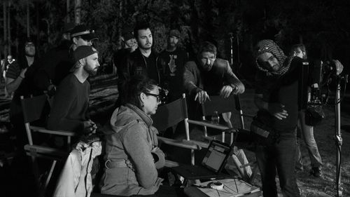 Director Drew Walkup reviews playback with Fox Hunt Drive cast and crew.