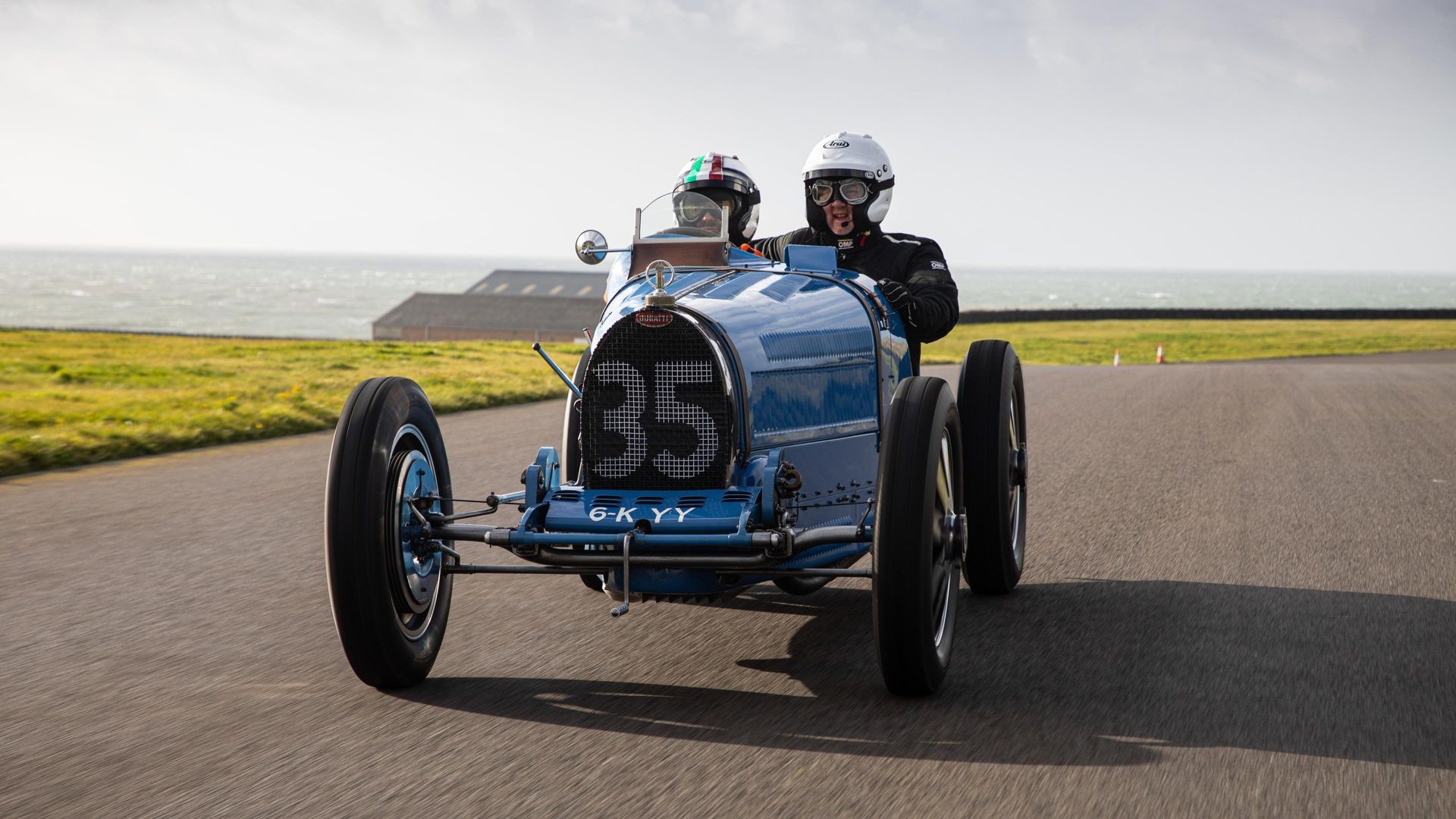 Three Men Four Wheels background