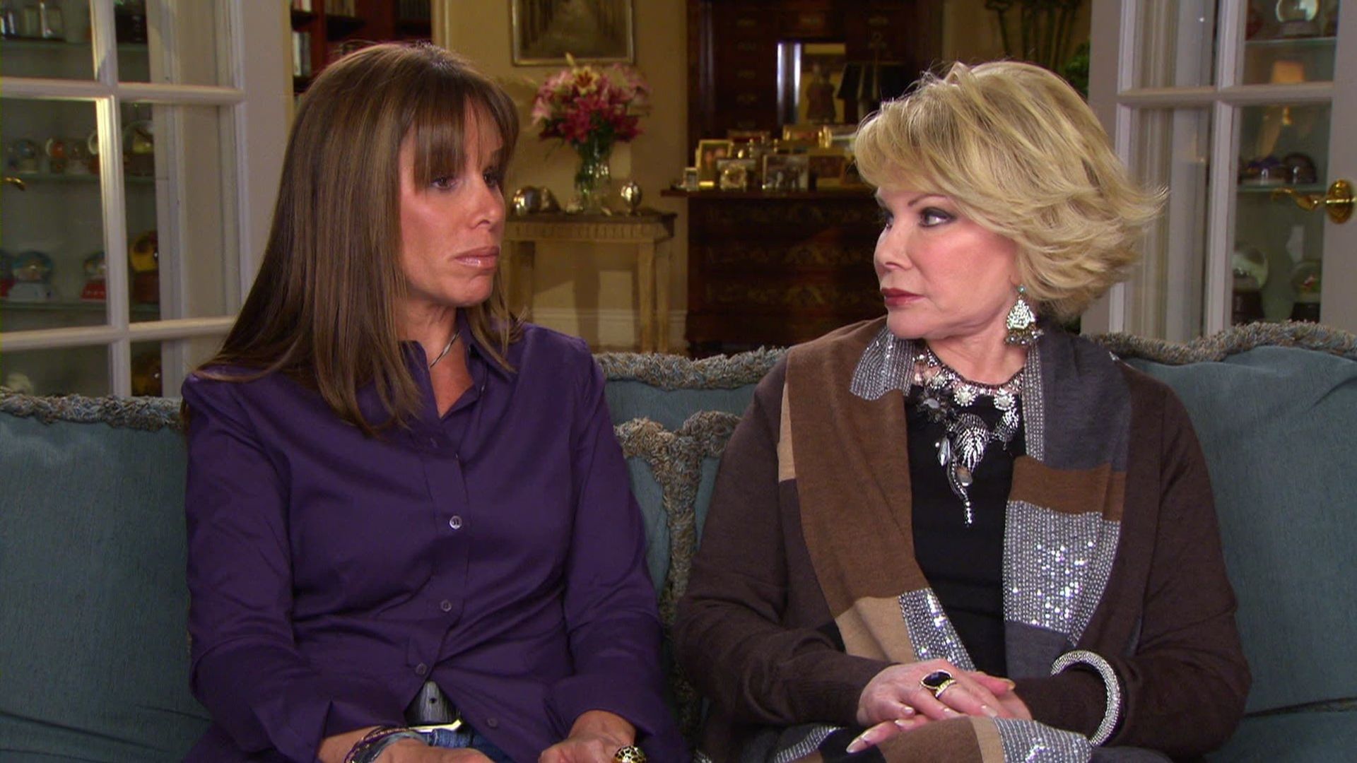 Joan & Melissa: Joan Knows Best? background