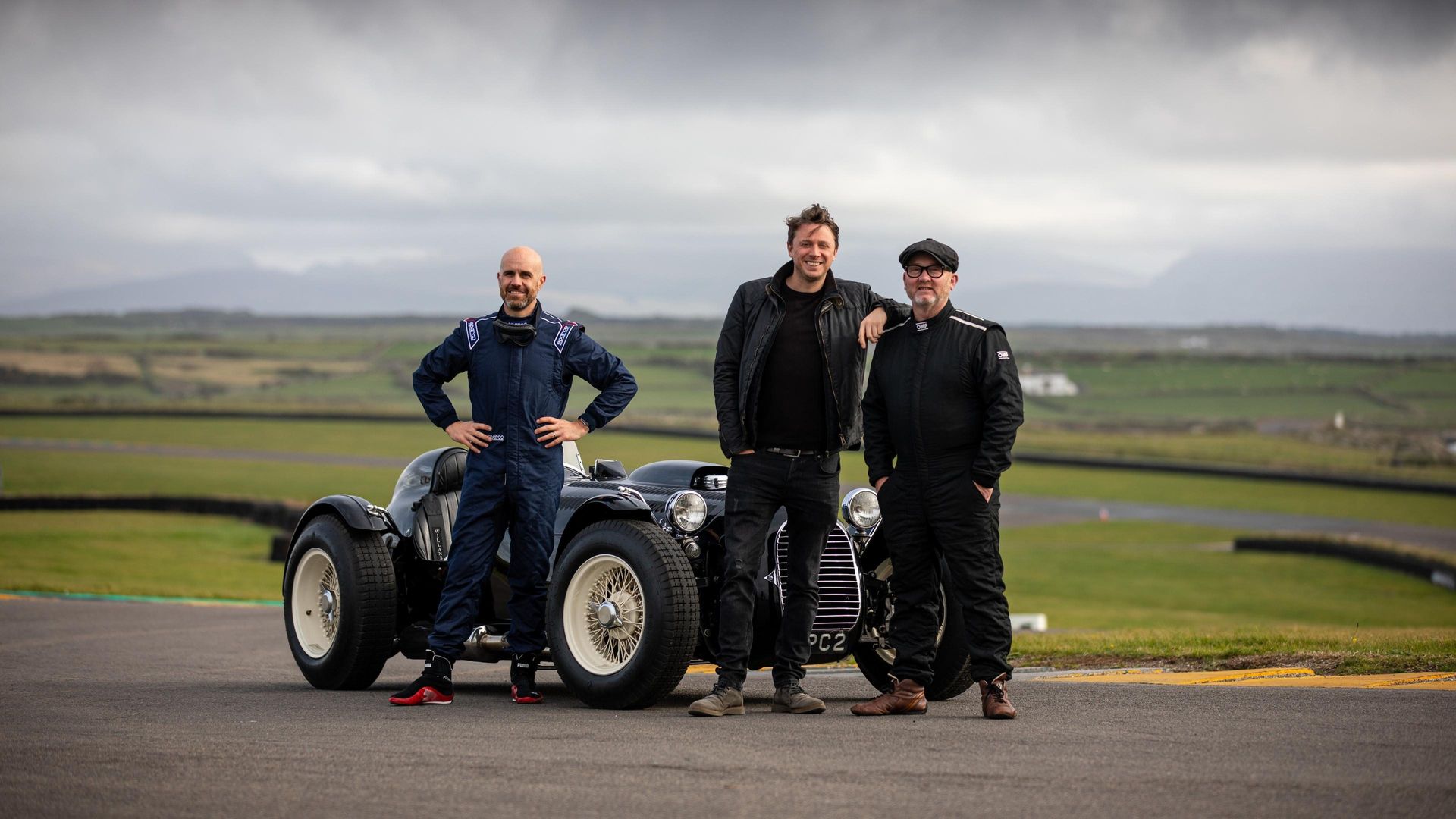 Three Men Four Wheels background