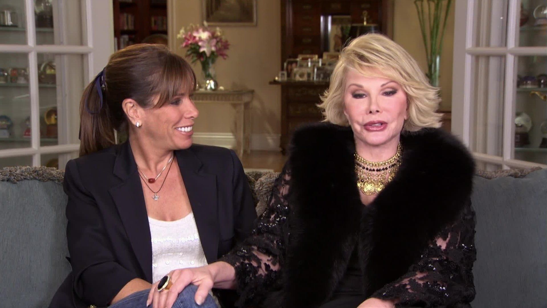 Joan & Melissa: Joan Knows Best? background