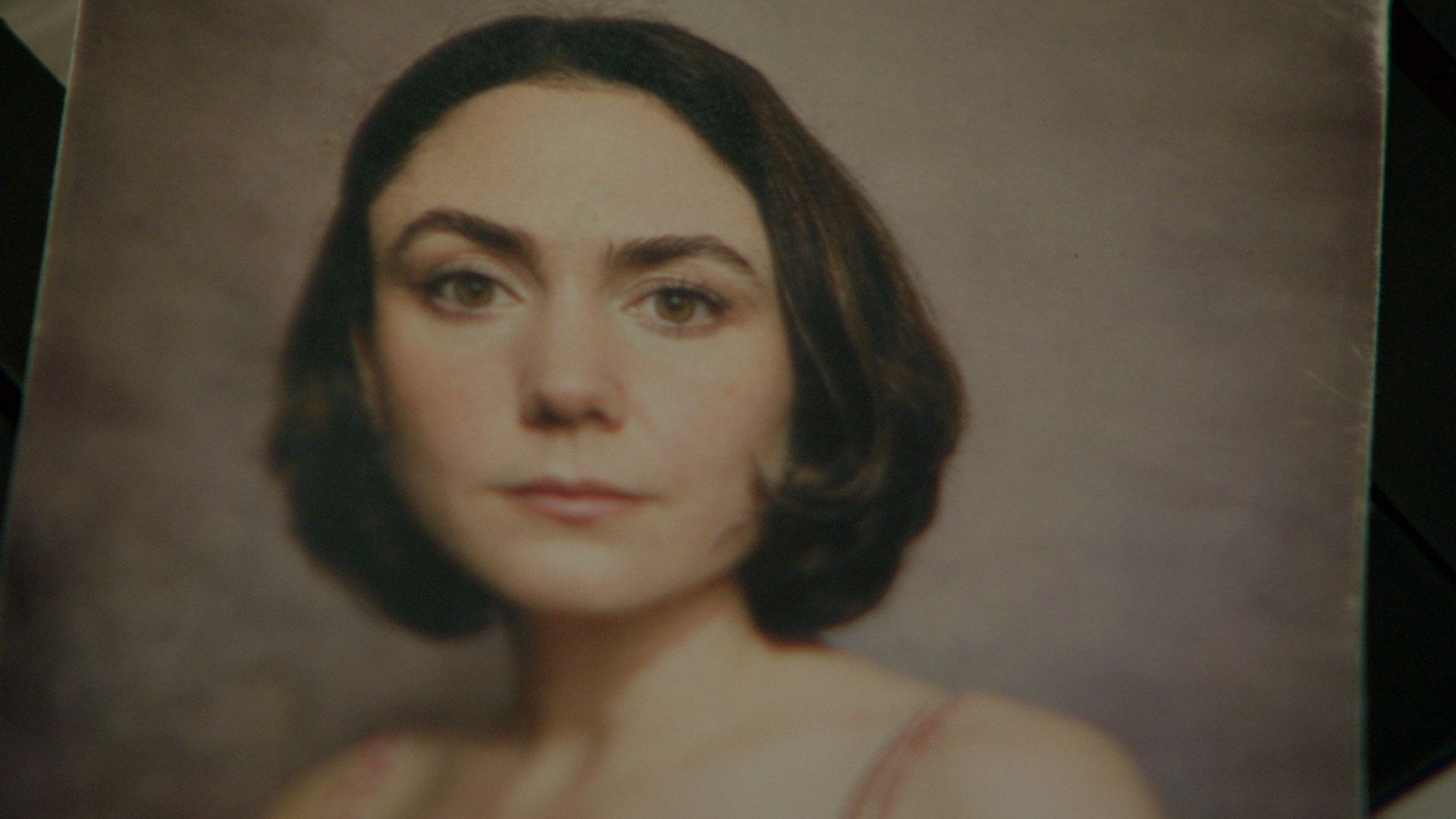 Lucía, the Woman Without a Face background