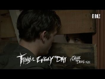 Coré encounters a man in a drab apartment
