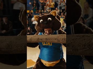 Woodchuck Todd Does His Best to Rally the Crowd During a School Assembly (Scene)